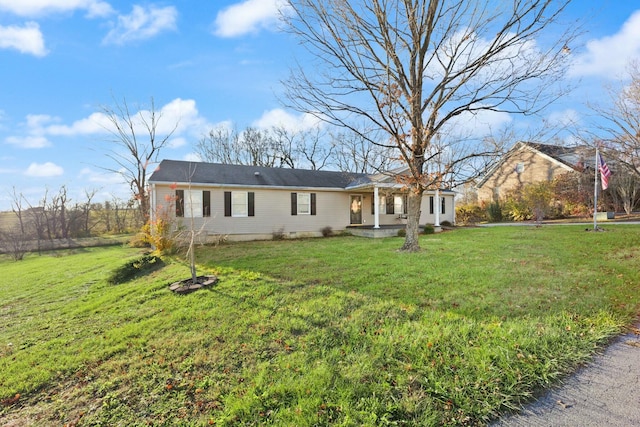 ranch-style home with covered porch and a front lawn