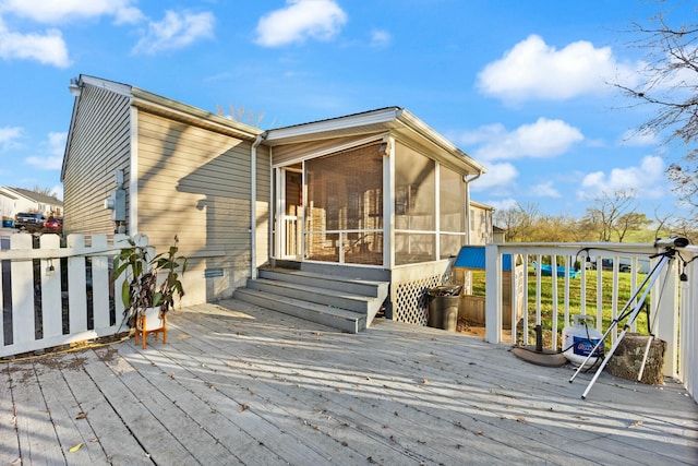 deck with a sunroom