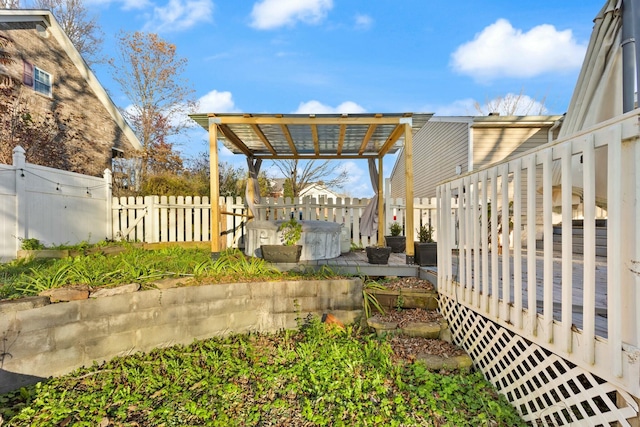 view of yard with a pergola and a wooden deck