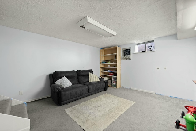 carpeted living room with a textured ceiling