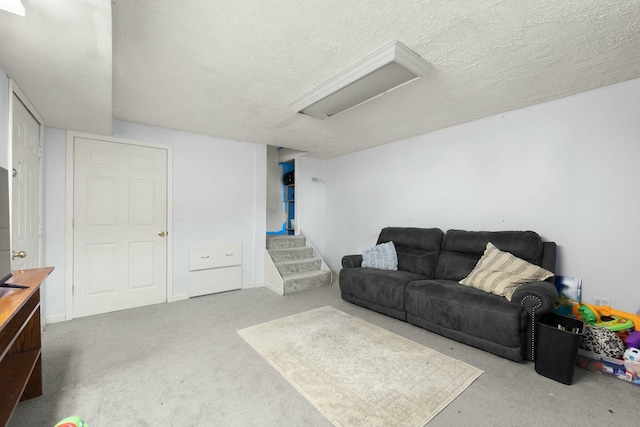 living room with carpet and a textured ceiling