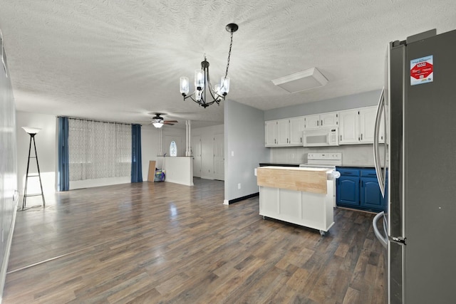 kitchen with a center island, white appliances, white cabinets, ceiling fan with notable chandelier, and blue cabinets