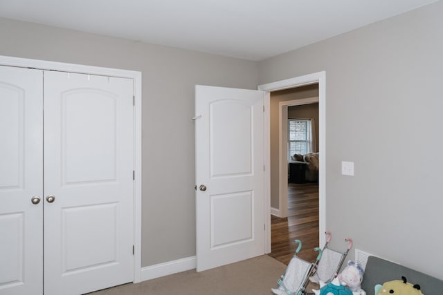 bedroom featuring light hardwood / wood-style floors and a closet