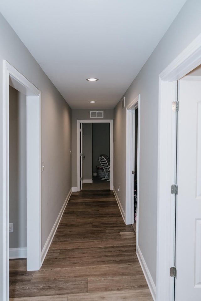 hall with dark wood-type flooring