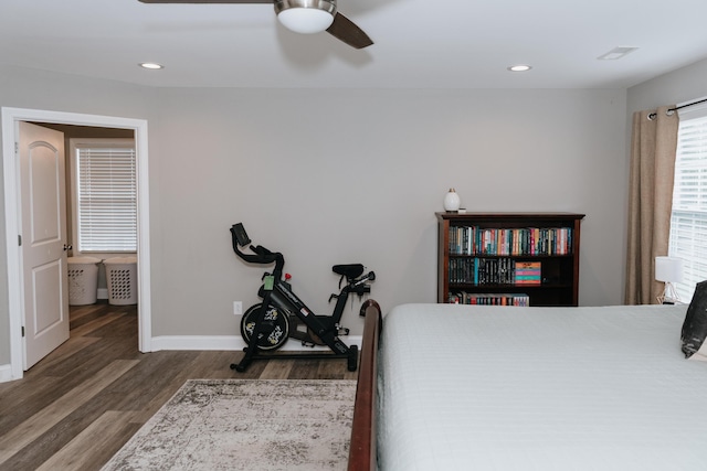 bedroom with ceiling fan and dark hardwood / wood-style floors