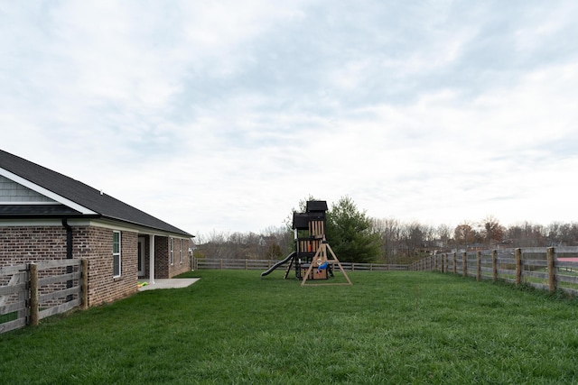 view of yard featuring a playground