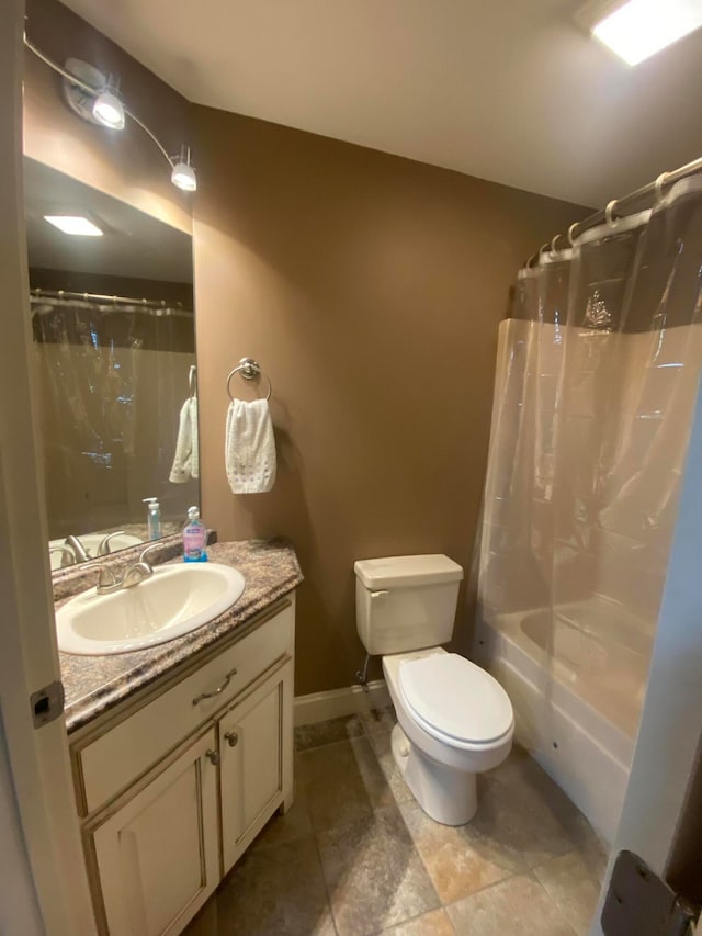 full bathroom featuring shower / bath combo, vanity, and toilet