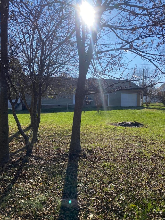 view of yard featuring a garage