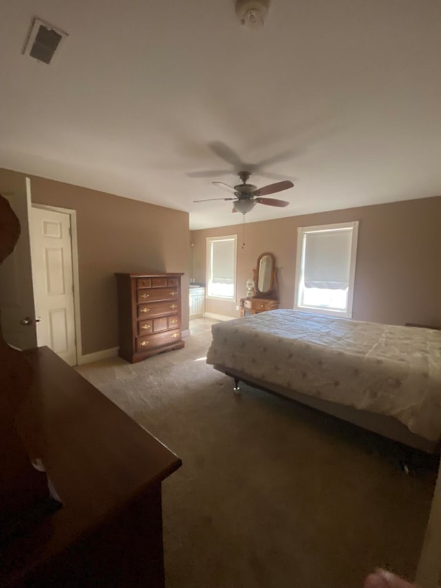 carpeted bedroom with ceiling fan