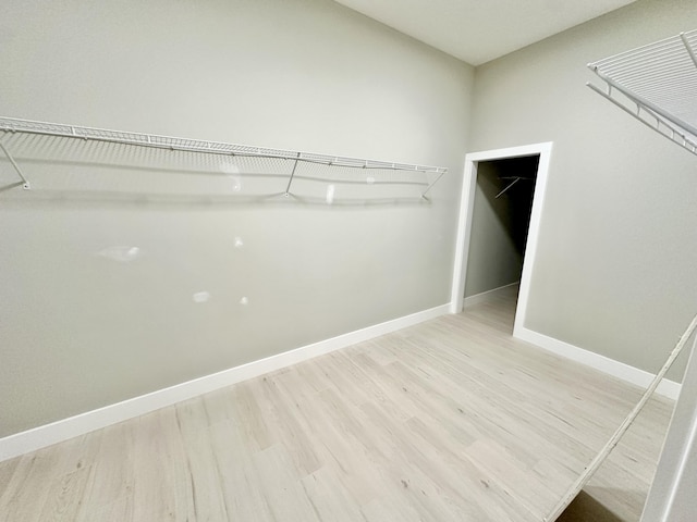 spacious closet with light wood-style floors