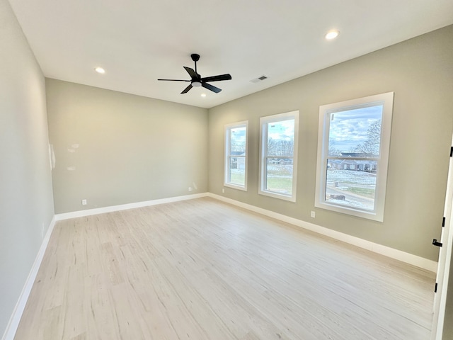 unfurnished room with light wood-style flooring, recessed lighting, baseboards, and visible vents