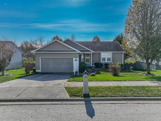 single story home featuring a garage and a front lawn