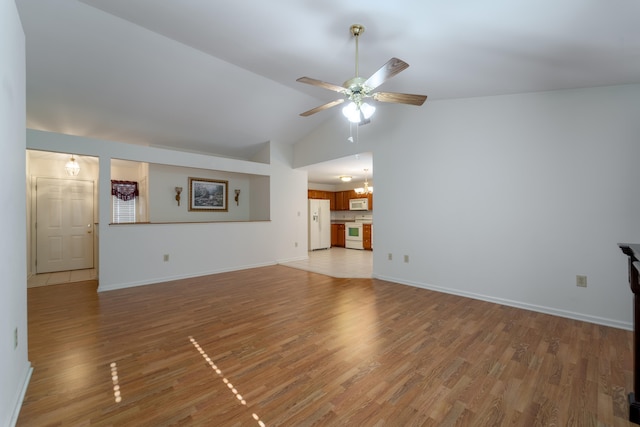 unfurnished living room featuring high vaulted ceiling, wood-type flooring, and ceiling fan with notable chandelier