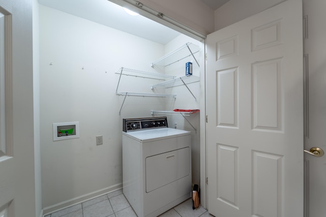 laundry room with light tile patterned floors and washer / clothes dryer