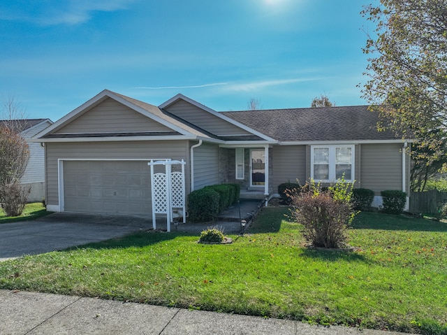 ranch-style house featuring a garage and a front yard