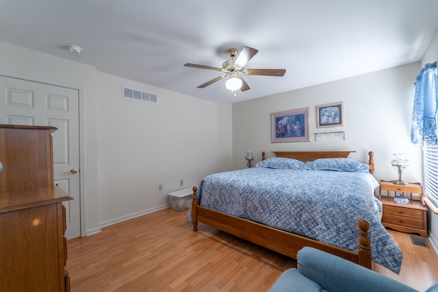 bedroom with light wood-type flooring and ceiling fan