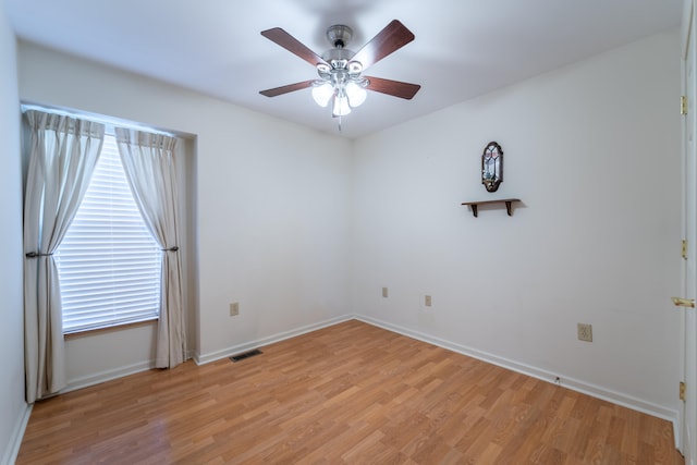 empty room featuring ceiling fan and light wood-type flooring