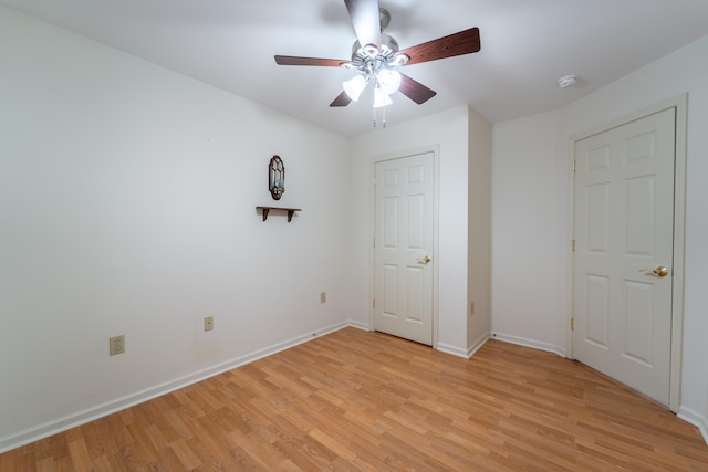 unfurnished bedroom featuring ceiling fan and light hardwood / wood-style flooring