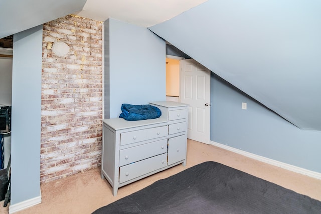 bonus room featuring light carpet and vaulted ceiling