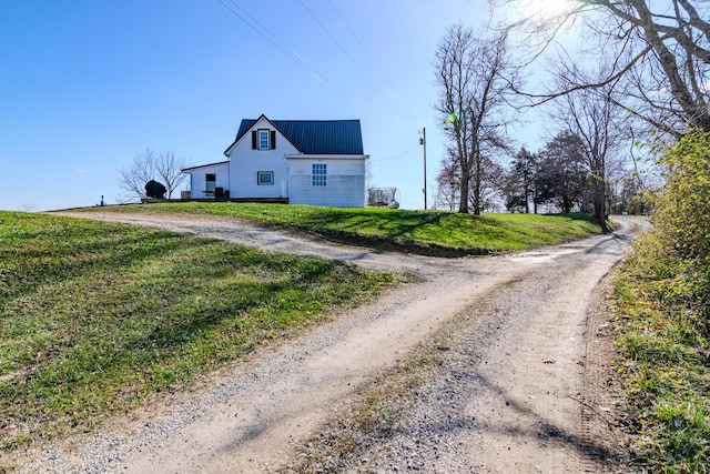 view of side of home featuring a yard