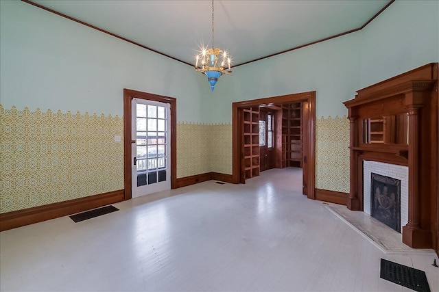 unfurnished dining area with hardwood / wood-style floors and an inviting chandelier