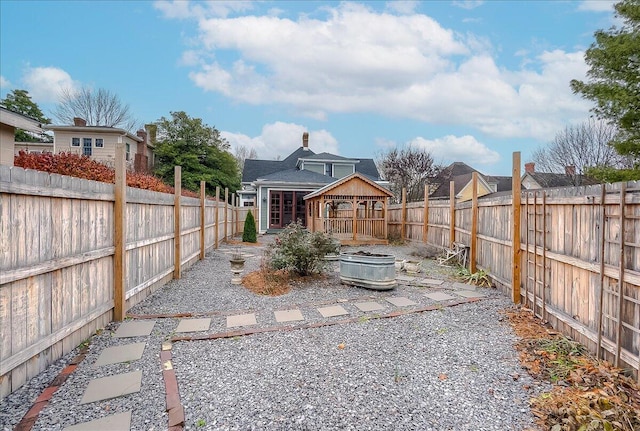 view of yard with a wooden deck and a patio area