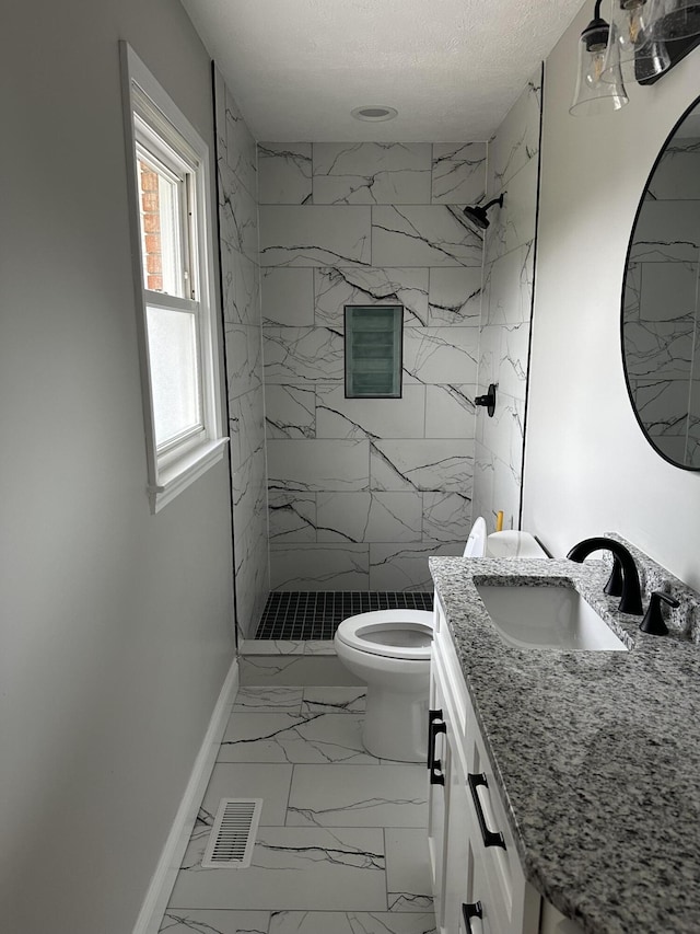 full bath with baseboards, visible vents, a textured ceiling, toilet, and marble finish floor