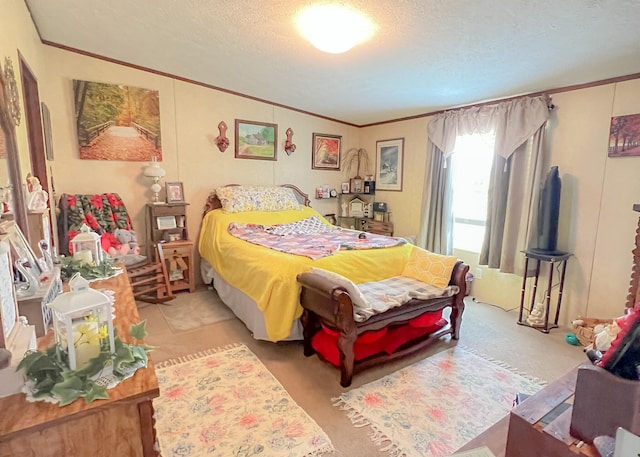 bedroom featuring crown molding, a textured ceiling, and light carpet