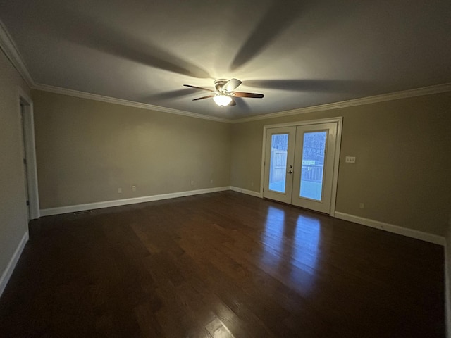 empty room featuring ceiling fan, french doors, dark hardwood / wood-style flooring, and crown molding