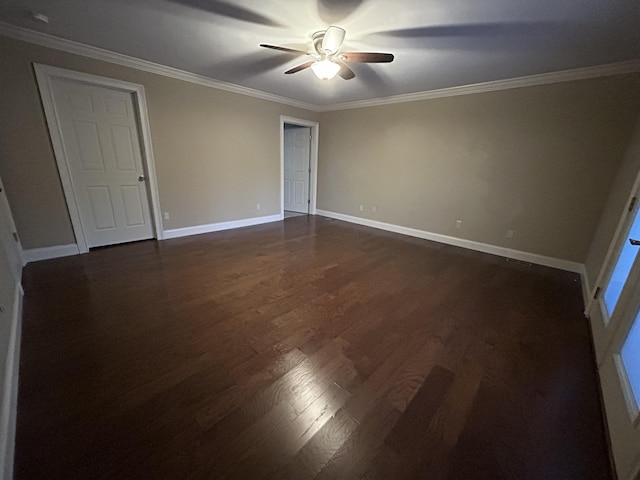 unfurnished bedroom with ceiling fan, dark hardwood / wood-style flooring, and ornamental molding