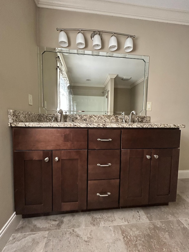 bathroom with vanity and crown molding