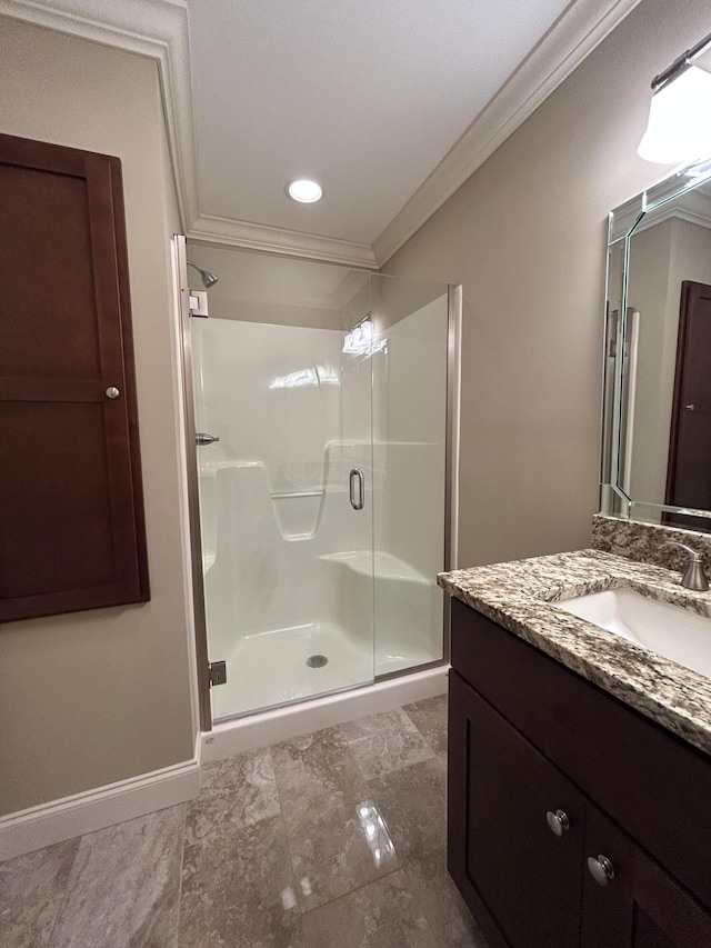 bathroom with a shower with door, crown molding, and vanity