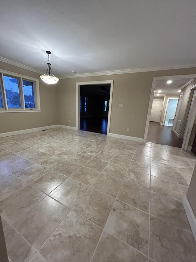 unfurnished room with crown molding