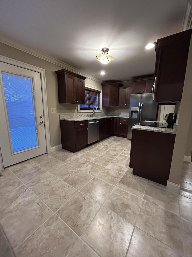 kitchen featuring sink, light stone countertops, stainless steel appliances, ornamental molding, and dark brown cabinets