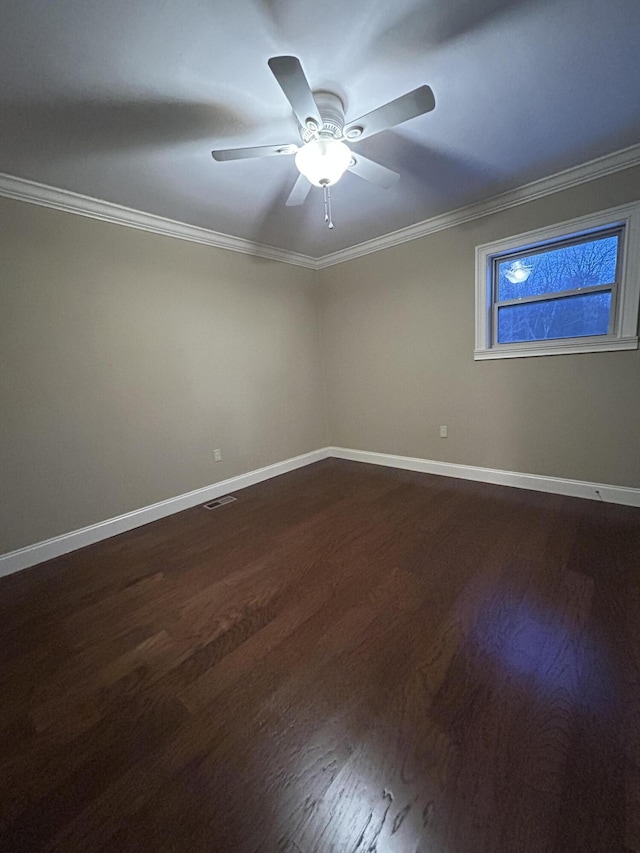 spare room featuring hardwood / wood-style flooring, crown molding, and ceiling fan