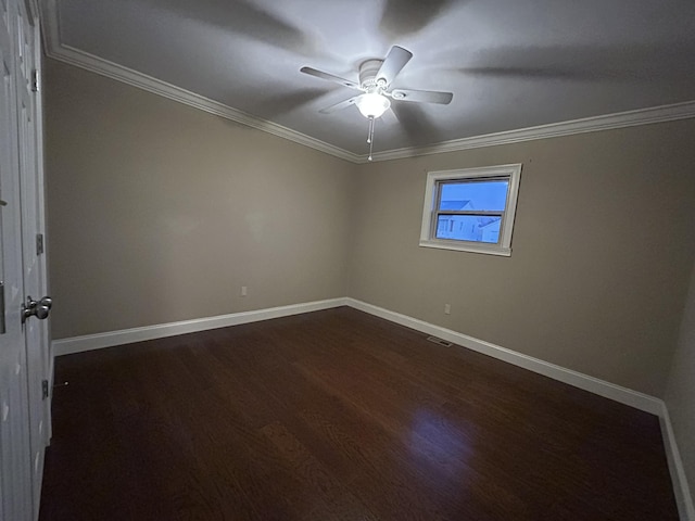 unfurnished room featuring ceiling fan, crown molding, and dark hardwood / wood-style floors