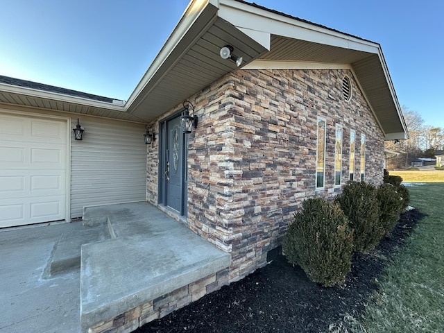 property entrance with a garage