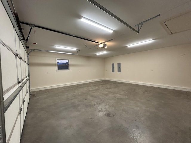 garage with a garage door opener and electric panel