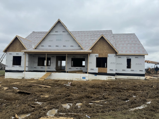 property in mid-construction with covered porch