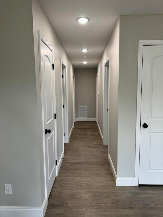 corridor with dark wood-type flooring