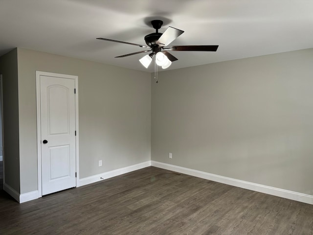 empty room featuring dark hardwood / wood-style floors and ceiling fan