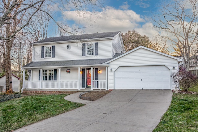 view of front property featuring a front lawn, covered porch, and a garage