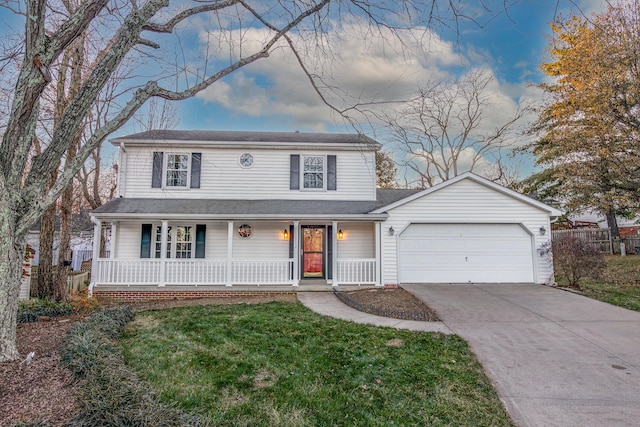 front facade featuring a front yard and a garage