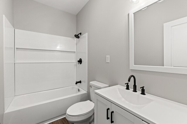 full bathroom featuring hardwood / wood-style flooring, vanity, toilet, and bathing tub / shower combination