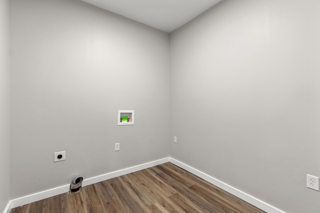 clothes washing area with hookup for a washing machine, wood-type flooring, and hookup for an electric dryer