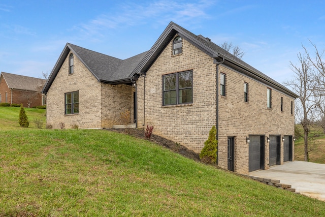 view of front facade with a garage and a front lawn