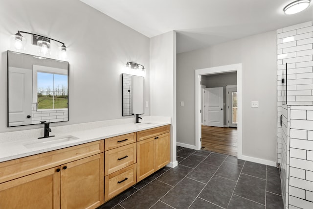 bathroom with tile patterned flooring and vanity