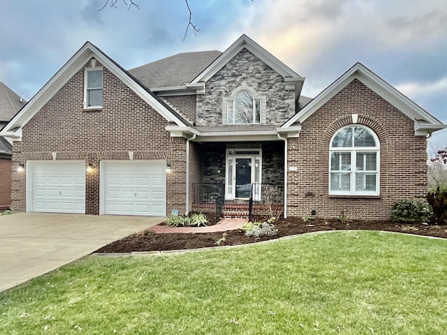 view of front of property with a front yard and a garage