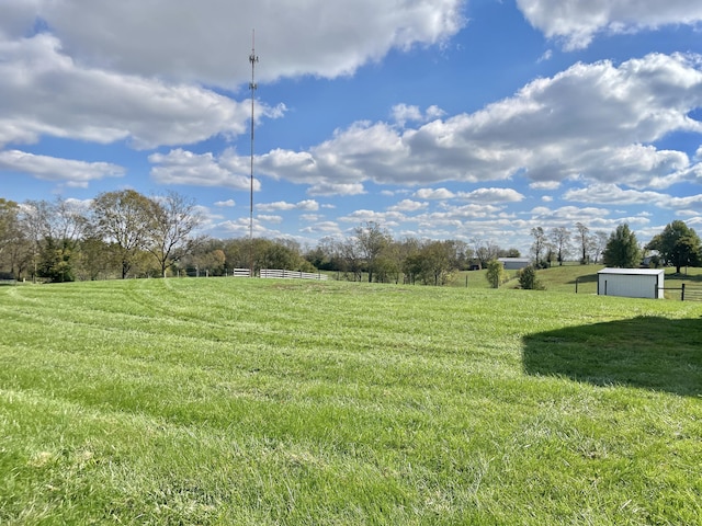 view of yard with a rural view