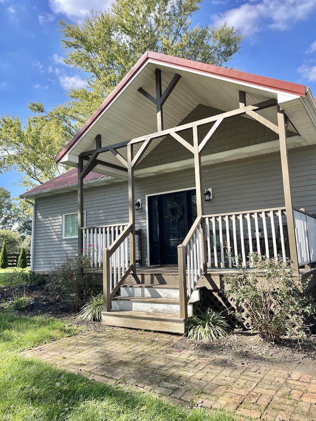 doorway to property featuring a porch